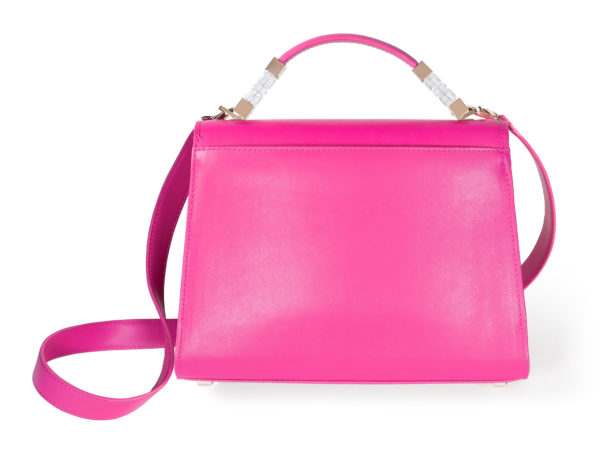 Back view of the Jewel Satchel handbag in smooth fuchsia pink Italian leather. The shoulder strap has a yellow gold clasp that attaches to a yellow gold ring fixed to the base of the top handle hardware.