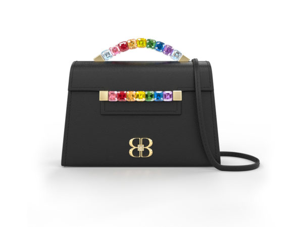 Front view of black Rainbow Baby Jewel Crossbody bag with a tapered trapezoidal shape, multi-colored Swarovski crystal top handle and front strap, yellow gold hardware, yellow gold and crystal BB plaque, and black detachable shoulder strap.
