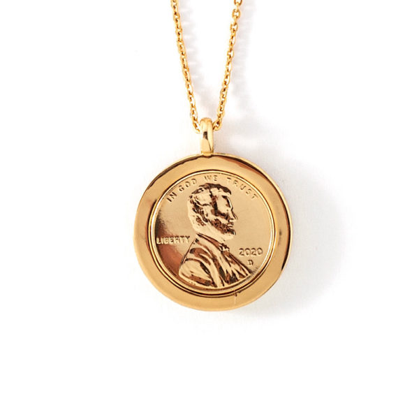 Front view of the Promise, Wear to Evoke Hope pendant and necklace with gold loop on top and gold chain. The penny includes a side profile bust of Abraham Lincoln, the year 2020, the word, Liberty, and the phrase, “In God We Trust.”